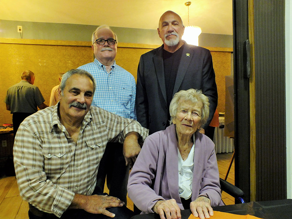 Special Guest 
Retired English teacher Betty Martuscello is flanked by class representatives Dominick Tomanelli 1972 (kneeling) and standing L-R, Brian Kaley 1970 and Charlie Alonge 1971. Martuscello, now 100, began her teaching career in Marlboro in 1943 and retired in 1985, having taught these three reunion classes.